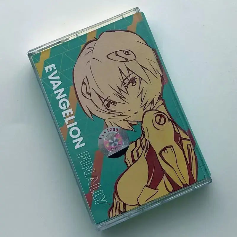 Teal and yellow neon genesis evangelion cassette tape featuring evangelion shiro sagisu character and text evangelion finally