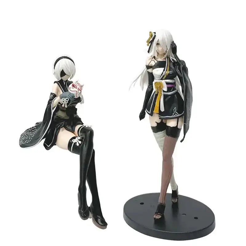 Two black and white PVC anime girl figures from NieR Automata featuring yorha no 2 type b in kimono pose