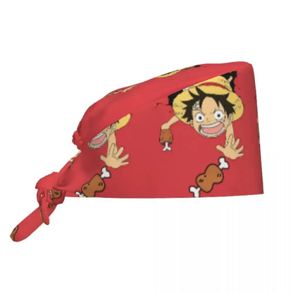Red bandana scrubs cap featuring one piece cartoon character with spiky black hair yellow hat and fried chicken illustrations
