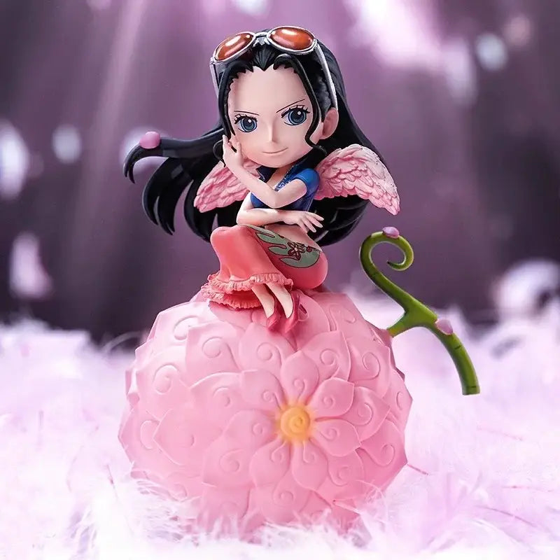 One Piece devil fruit night light figure in pink with flower patterns, black hair, and angel wings on fruit base