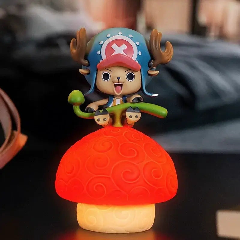 One piece devil fruit night light figure with vibrant red mushroom-shaped glowing base and cartoon character topper