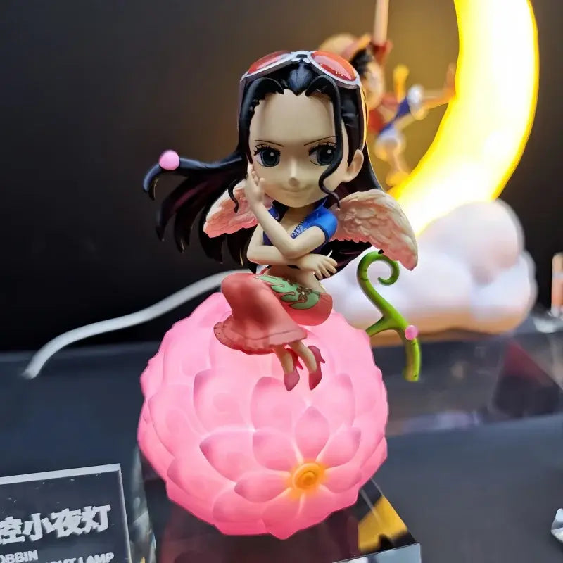 Pink glowing lotus-shaped one piece devil fruit night light figure with chibi anime character for desktop ornament
