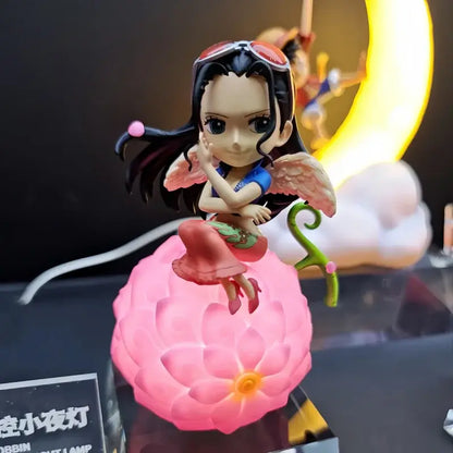 Pink glowing lotus-shaped one piece devil fruit night light figure with chibi anime character for desktop ornament
