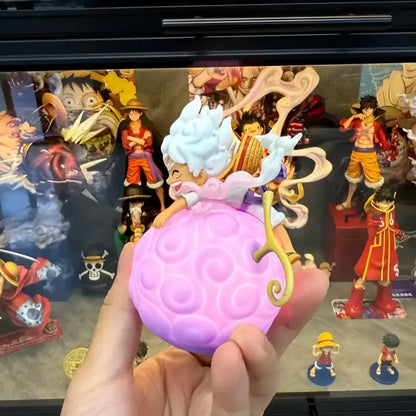 One piece devil fruit pink night light figure with textured surface and white-haired character for desktop decor