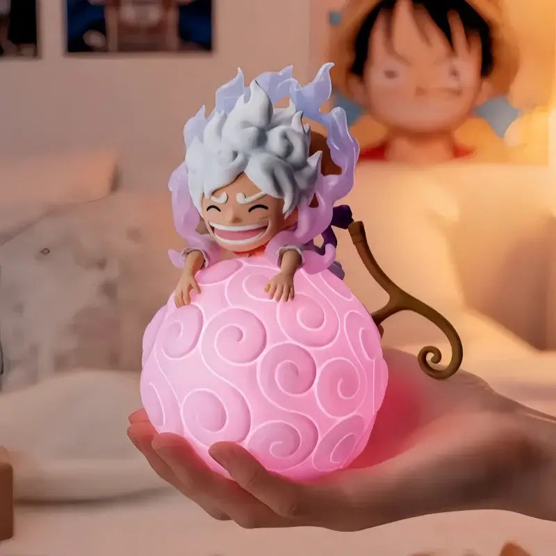 One piece devil fruit night light figure pink glowing spherical light figure with smiling character and spiky hair