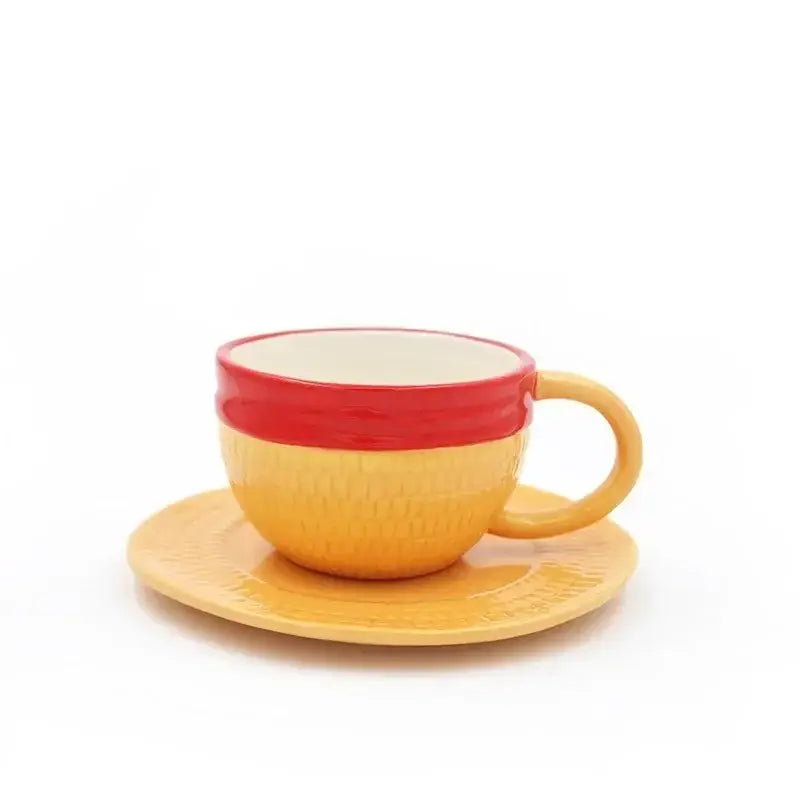 Yellow ceramic teacup with red rim and textured surface paired with matching saucer from one piece luffy ace sabo mug set