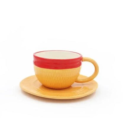 Yellow ceramic teacup with red rim and textured surface paired with matching saucer from one piece luffy ace sabo mug set
