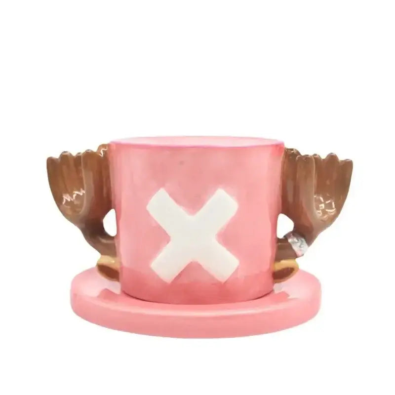 Pink ceramic mug with brown wing handles and white x emblem designed as the iconic one piece straw hat