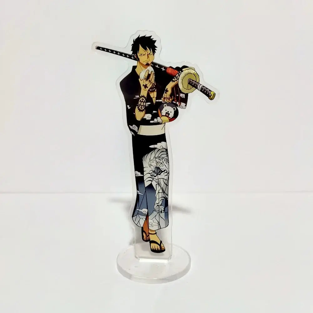 Clear acrylic stand featuring a black and white illustration of luffy in haki-themed outfit holding a red and gold sword
