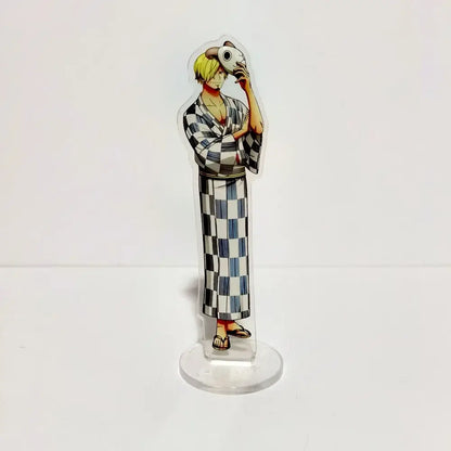 Clear acrylic stand featuring one piece luffy with blonde hair in a black and white checkered yukata holding a skull object