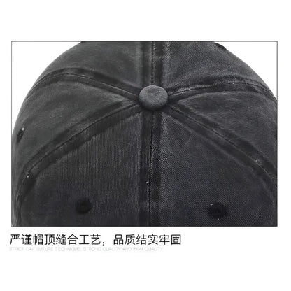 Dark gray denim one piece luffy washed retro baseball cap with matching button and visible stitching