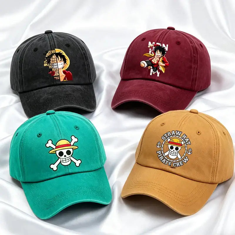 Four colorful washed retro baseball caps with one piece designs including luffy mask, pose, and straw hat emblem