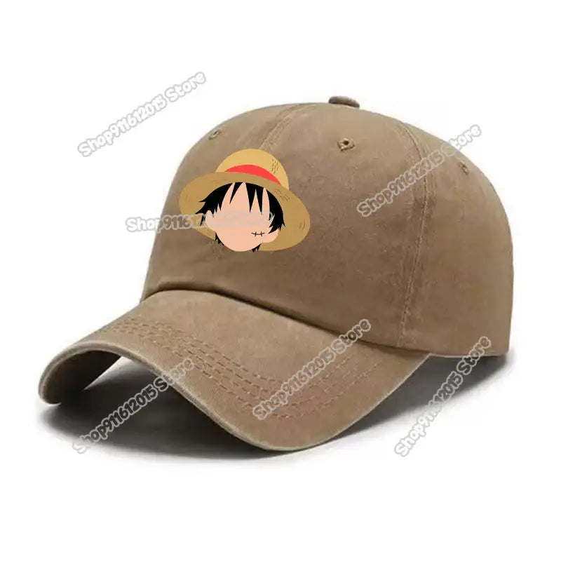 Tan washed retro baseball cap featuring a printed cartoon face of Luffy from One Piece wearing his straw hat