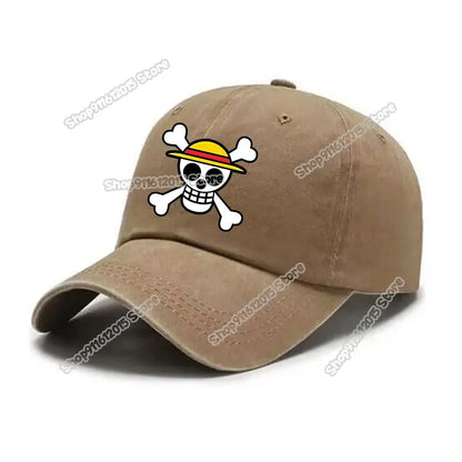 Tan washed retro baseball cap featuring a white skull and crossbones emblem with a yellow straw hat for one piece fans