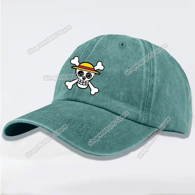 Teal washed retro baseball cap with embroidered skull and crossbones and yellow brim for casual wear