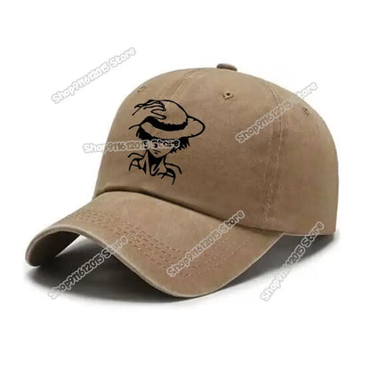 Tan one piece luffy baseball cap with black embroidered character design in washed retro style baseball cap