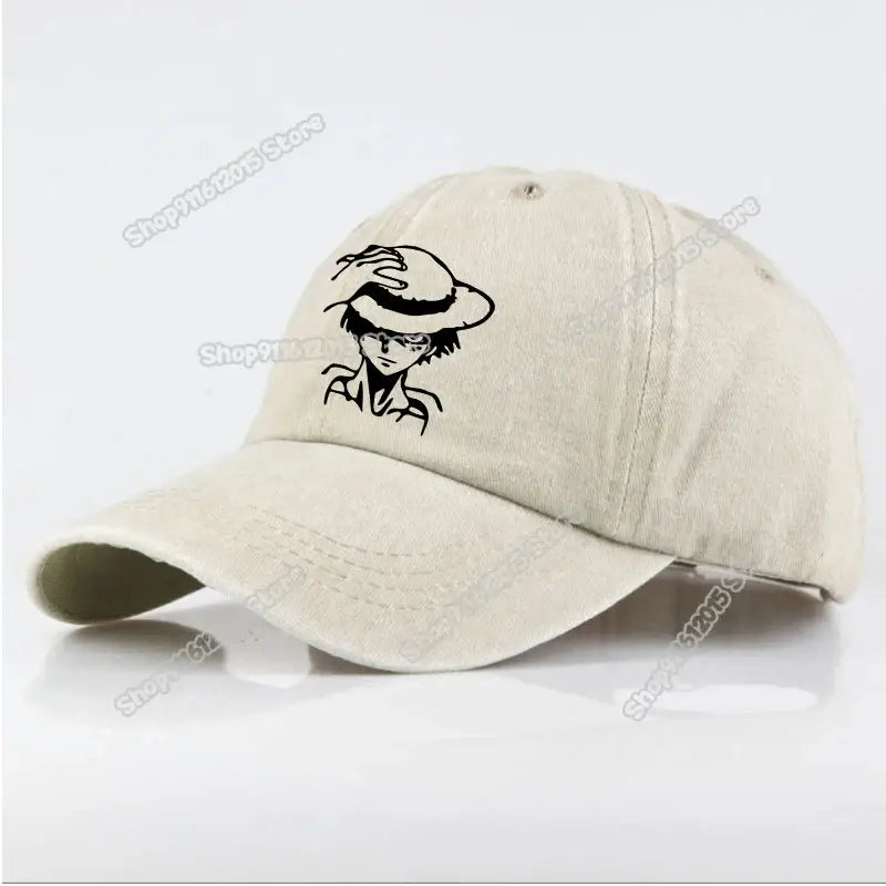 Beige washed retro baseball cap featuring black embroidered anime character luffy wearing a hat design