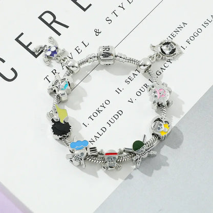 Silver-colored diy charm bracelet with colorful enamel one piece luffy character and skull motifs in skull diy style