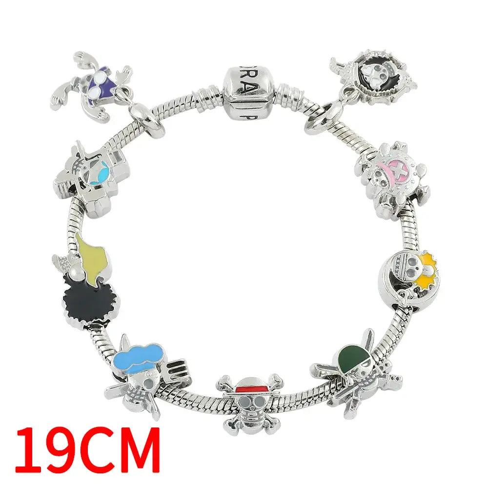Silver-colored diy charm bracelet featuring colorful enamel pirate-themed charms from one piece luffy skull style