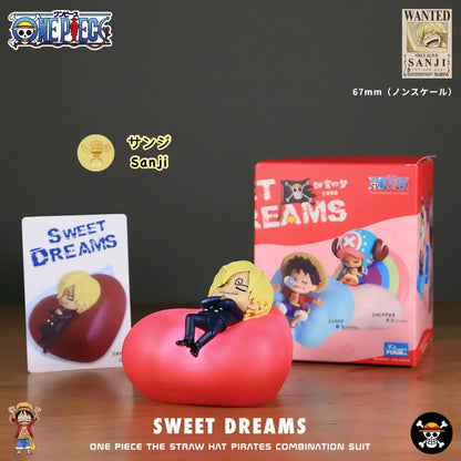 A plush red heart-shaped pillow with a sanji figurine beside one piece luffy led night light rechargeable lamp