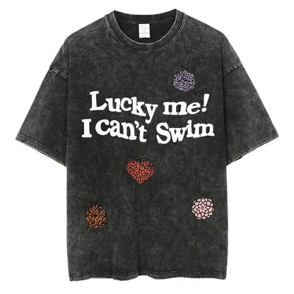 Black distressed One Piece Luffy oversized tee in washed cotton with anime graphic and colorful embroidered fruit for street style