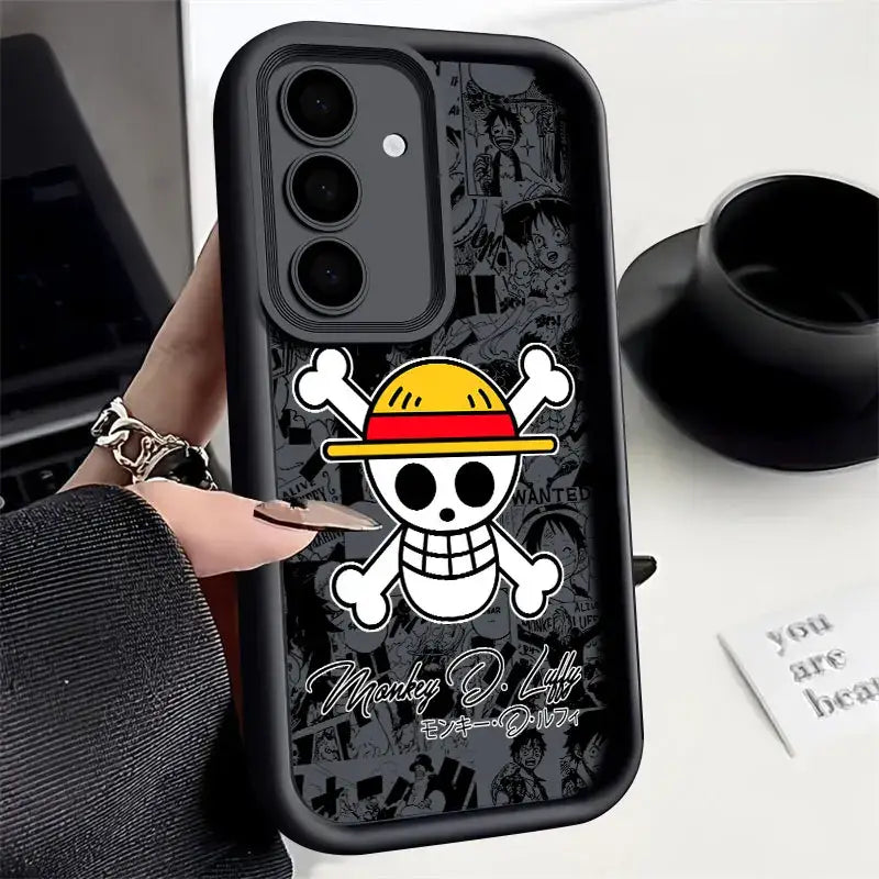 Black soft silicone piece luffy phone case featuring white skull with yellow and red straw hat on back side