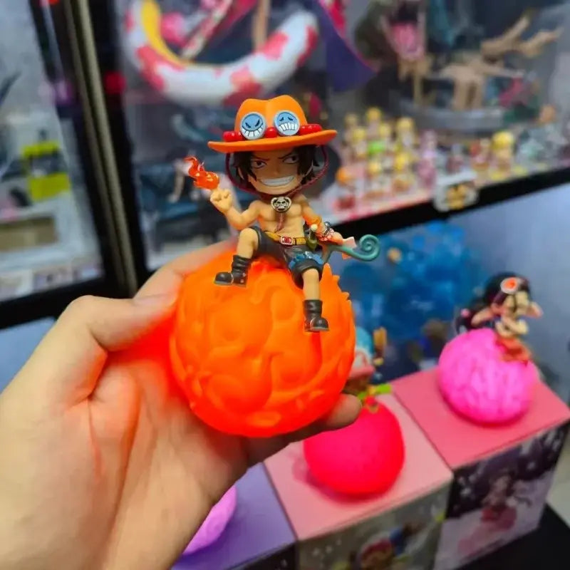 One piece luffy robin ace led lamp featuring an orange rubbery brain base with chibi luffy holding a red object