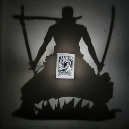 A black-and-white wanted poster of roronoa zoro featured in the one piece luffy shadow light projector 3d led lamp