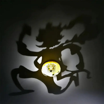 One piece luffy shadow light projector with a glowing yellow circular light casting a dynamic character shadow on the wall