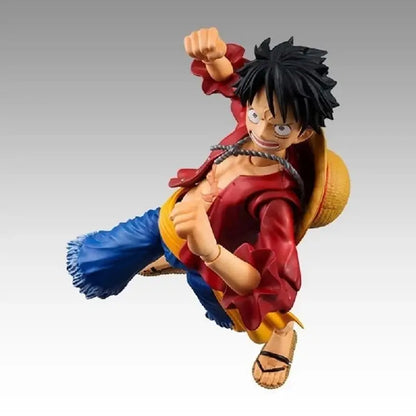 One Piece Monkey D Luffy action figure in red and blue outfit with yellow straw hat made of articulated PVC
