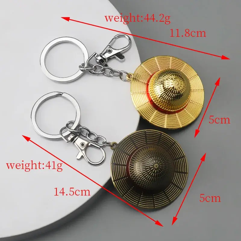 Gold and bronze metal luffy hat keychains shaped like straw hats with silver rings and clasps pendant keyring