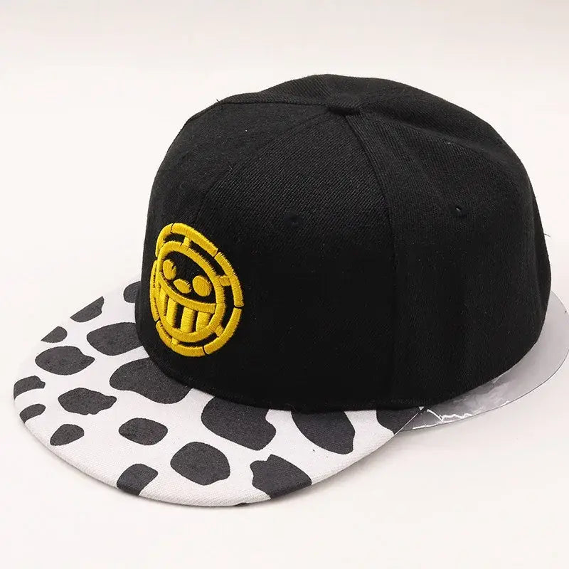 Black snapback one piece tony tony chopper baseball cap with yellow skull logo and white brim with black cow print