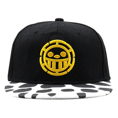 Black snapback cap with bold yellow skull logo and white brim with black cow print one piece tony tony chopper baseball cap