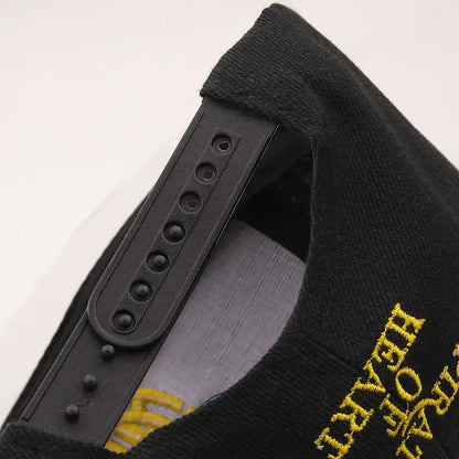 Black snapback cap with gold embroidered text and black plastic adjustable strap for one piece tony tony chopper fit