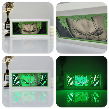 Green-lit one piece zoro paper cut shadow box light with spiky hair design and white frame led box light