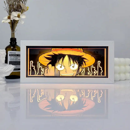 White-framed led shadow box light featuring an illuminated monkey d portrait with remote control for decorative use