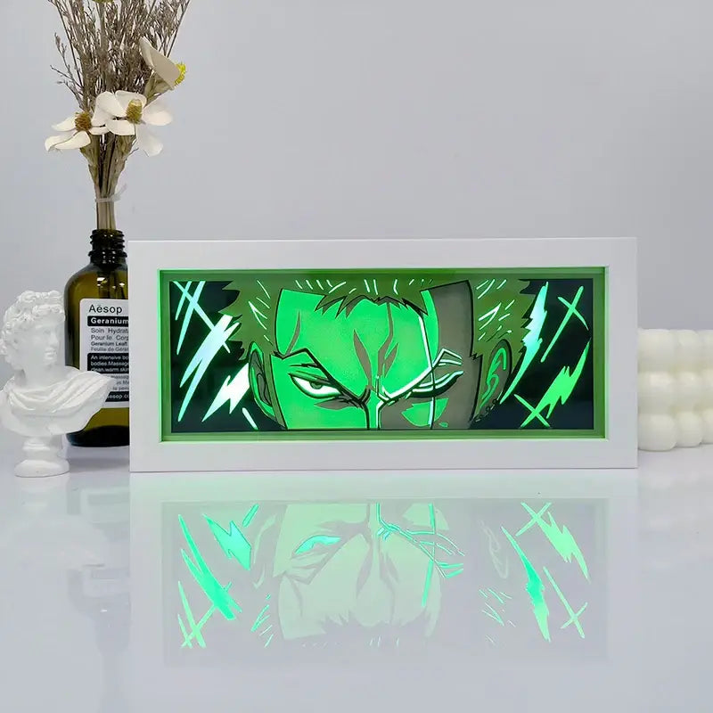 One piece zoro paper cut shadow box light with green LED illumination and acrylic frame featuring stylized face design