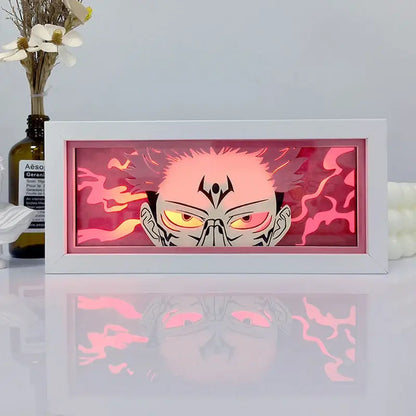 One piece zoro paper cut shadow box light featuring a glowing pink and orange illuminated anime face in a white frame