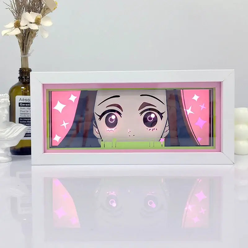 White rectangular frame shadow box light featuring glowing pink and green anime character portrait with starry accents