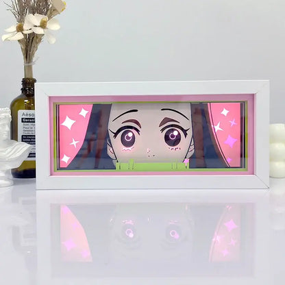 White rectangular frame shadow box light featuring glowing pink and green anime character portrait with starry accents