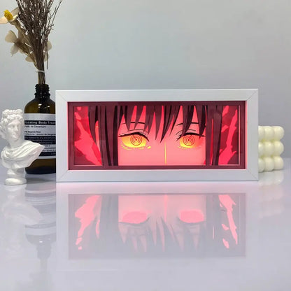 White-framed one piece zoro paper cut shadow box light with glowing orange anime eyes and red backlight box light