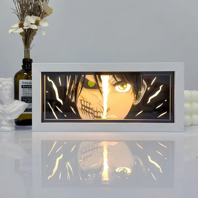 White-framed one piece zoro paper cut shadow box light featuring an illuminated split-face design with green eyes