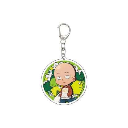 Circular acrylic keychain featuring a cartoon illustration of saitama from one punch man, depicted with his signature bald head and brown hoodie against a vibrant green background.