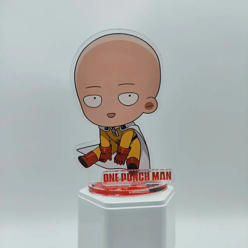 Clear acrylic saitama acrylic stand featuring chibi one punch man in yellow suit on transparent base with one punch man engraving