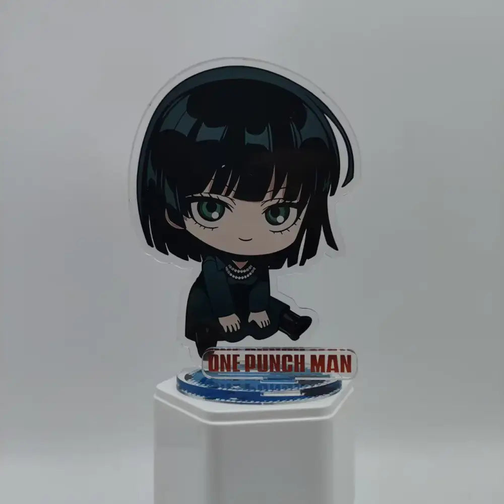 Clear acrylic saitama acrylic stand featuring chibi anime character with black hair green eyes and pearl necklace