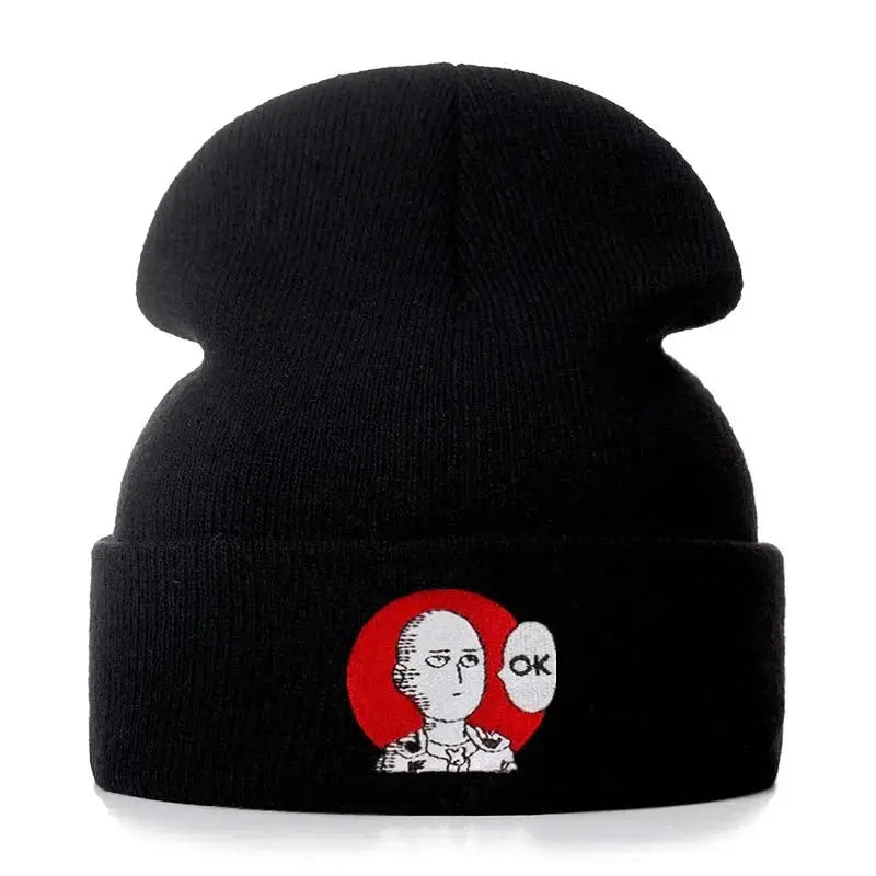 Black cotton knit beanie featuring embroidered punch man saitama with red circle and ok speech bubble design