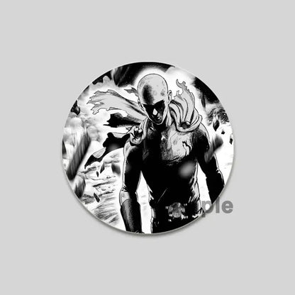 Black-and-white circular punch man saitama brooch pin featuring the character in a dynamic pose with flowing cape