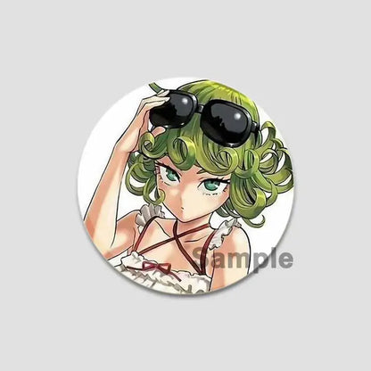Circular one punch man saitama button pin featuring anime character with green curly hair and black sunglasses