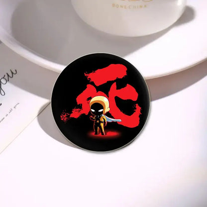 Black circular enamel badge lapel pin featuring chibi saitama from one punch man with red japanese kanji