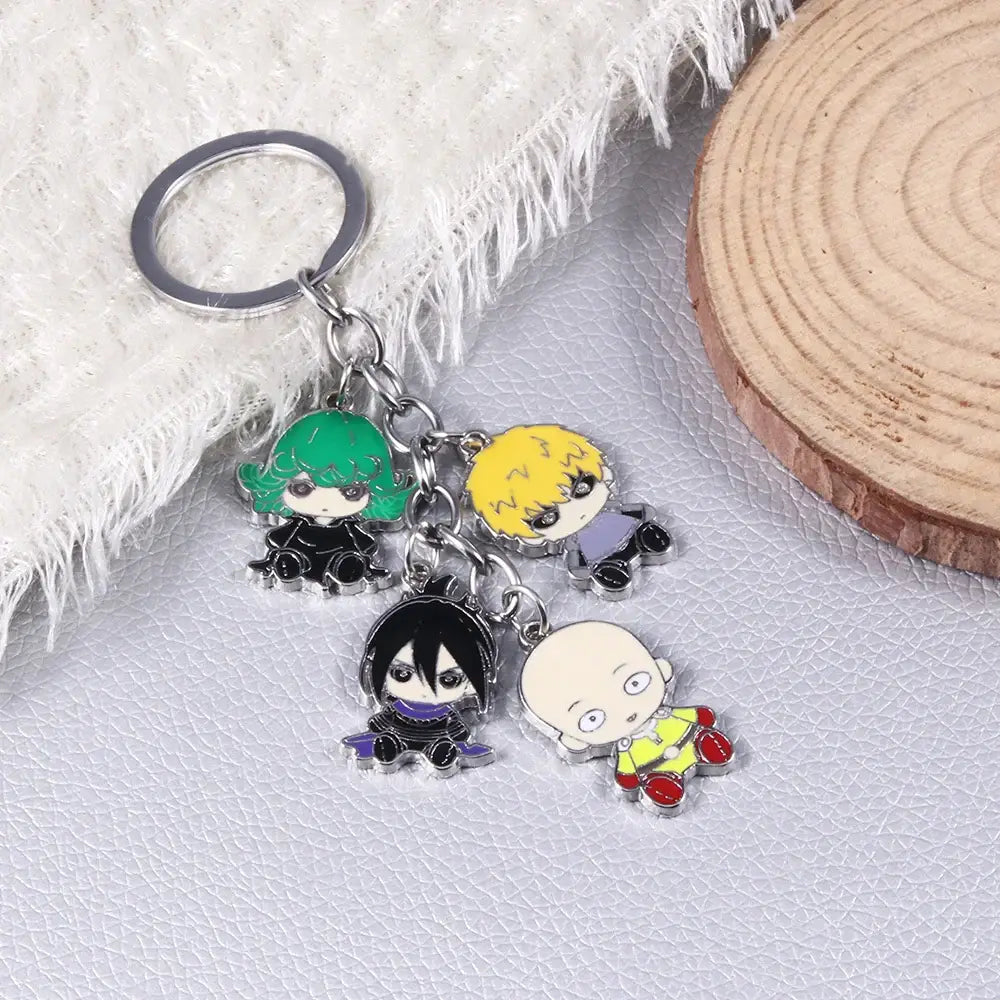 One punch man saitama metal keychain with four colorful chibi anime charms and silver-toned metal links